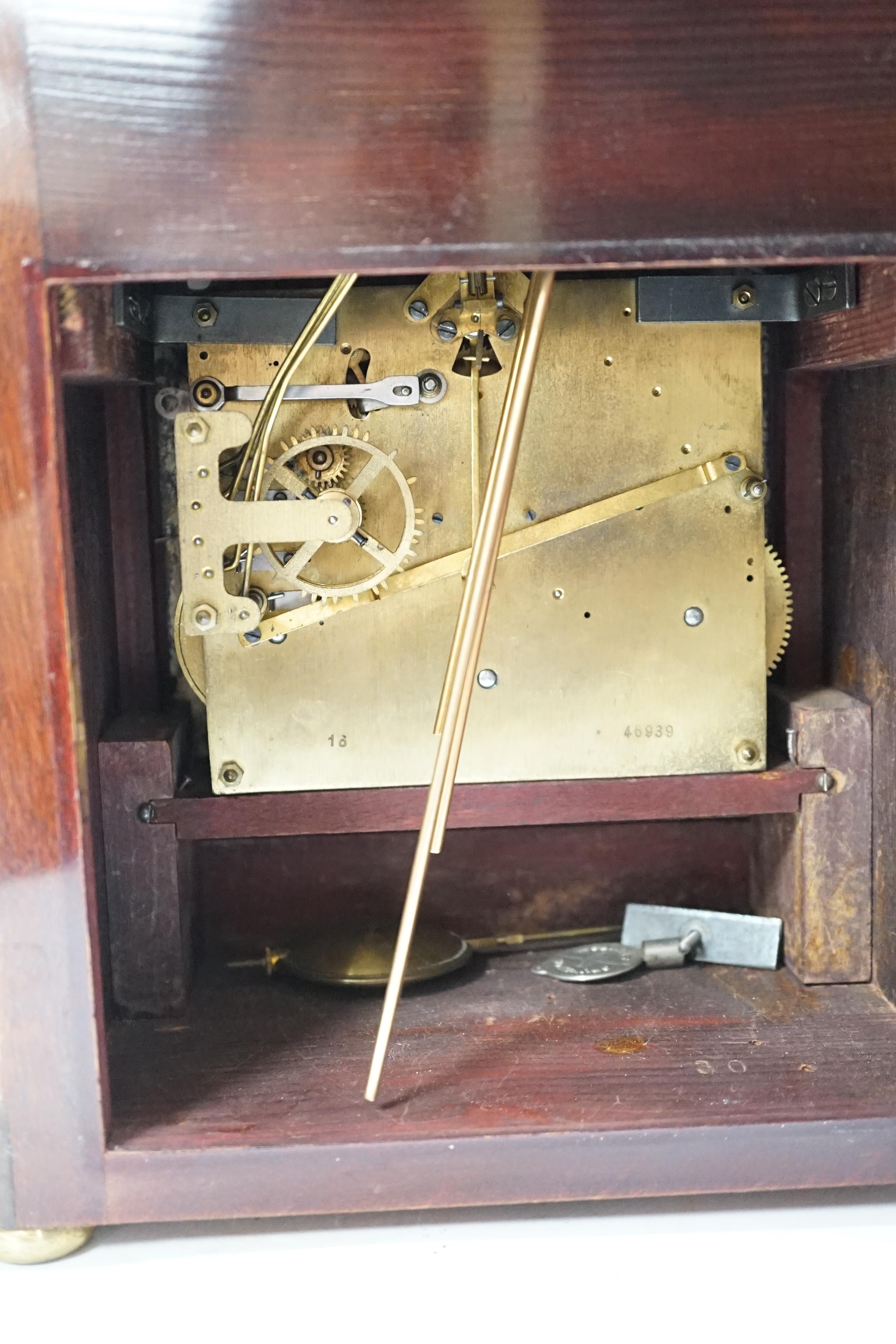 An early 20th century mahogany chiming bracket clock with silvered Roman numeral dial, 34cm high